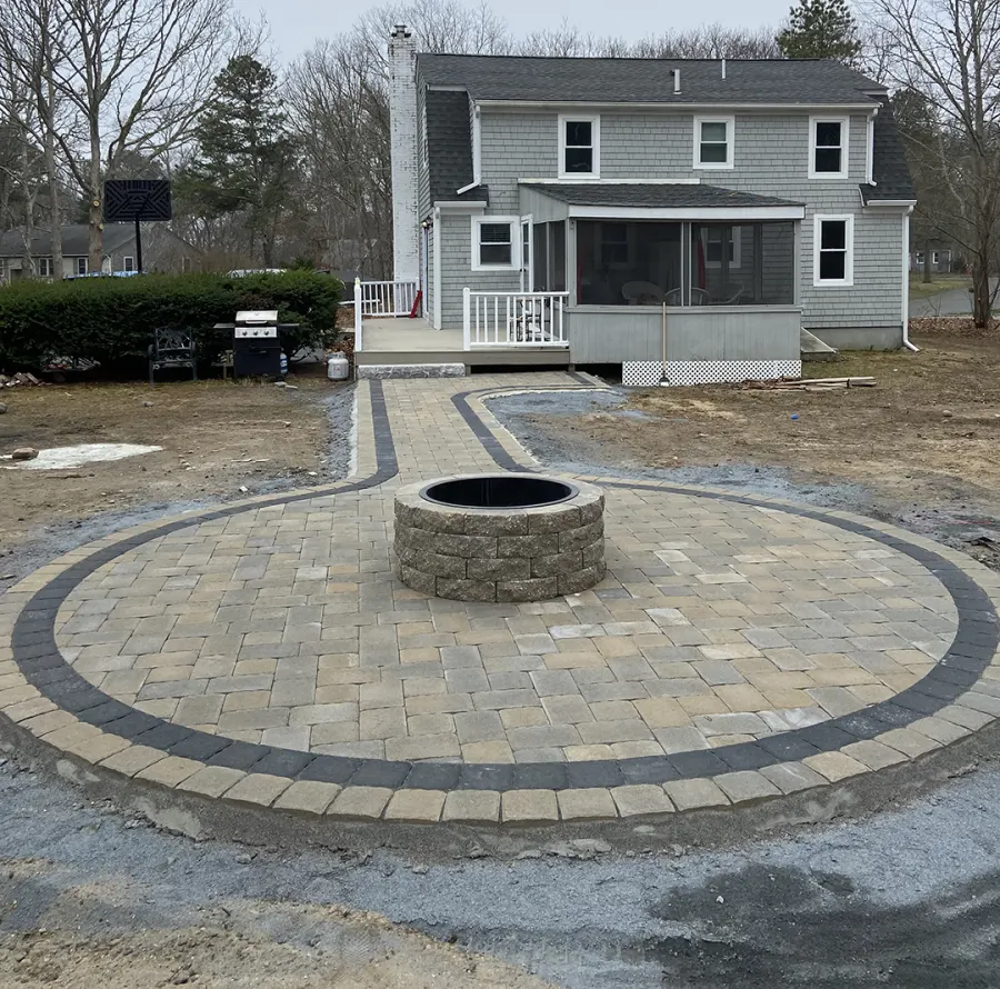 Paver patio with a stone fire pit